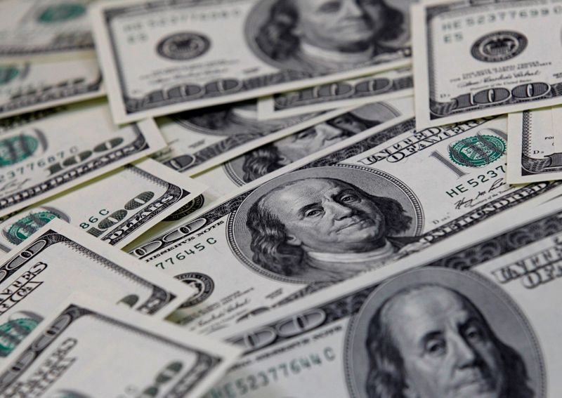 Dollar holds near two-week lows in Fed's wake